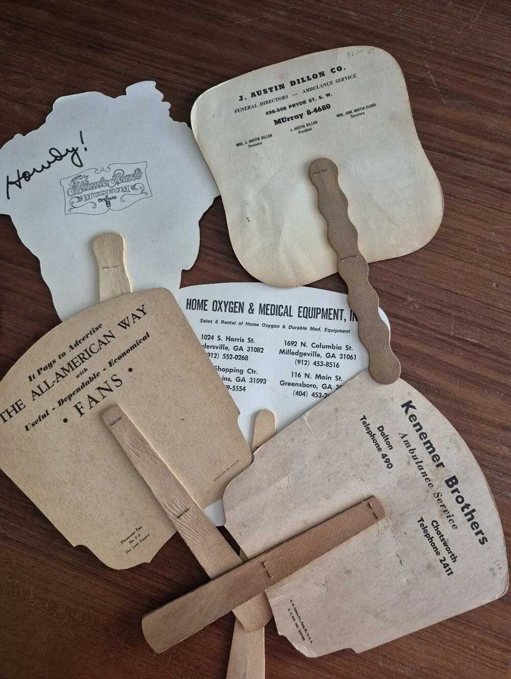 Assorted vintage advertising fans